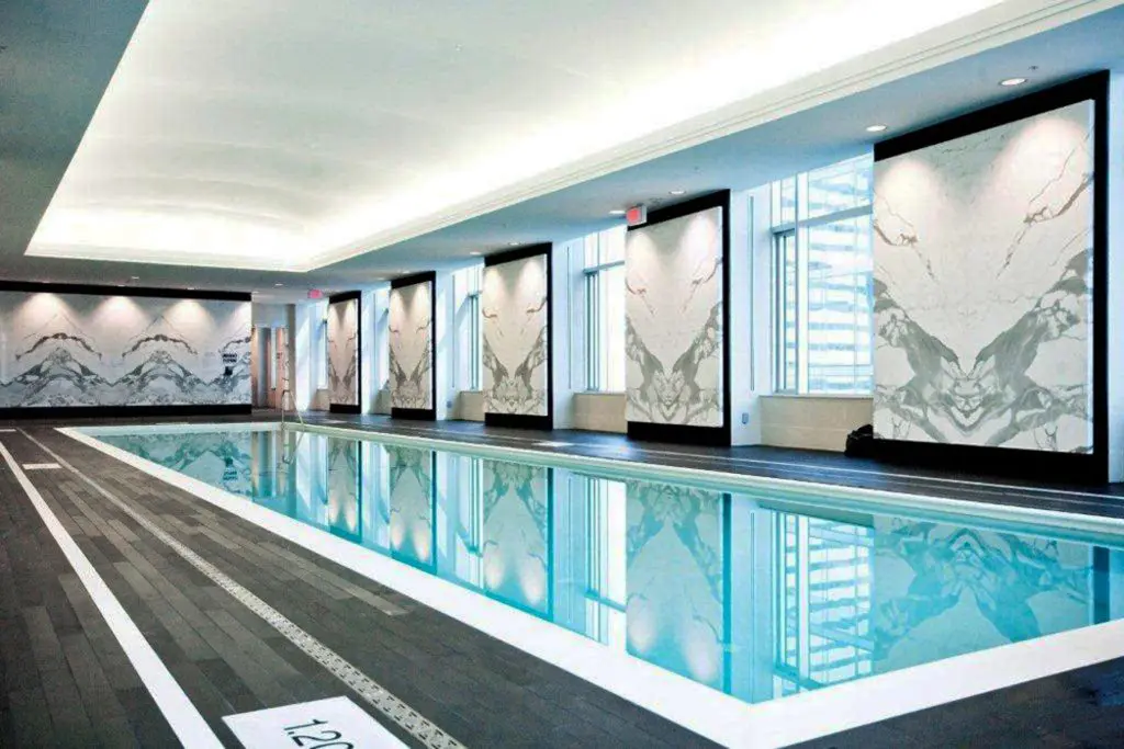 swiming pool area with custom wall murals and stretch ceiling glossy