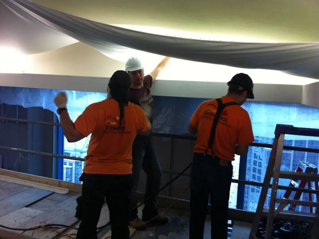 preparing fabric for stretch ceiling in custom hotel