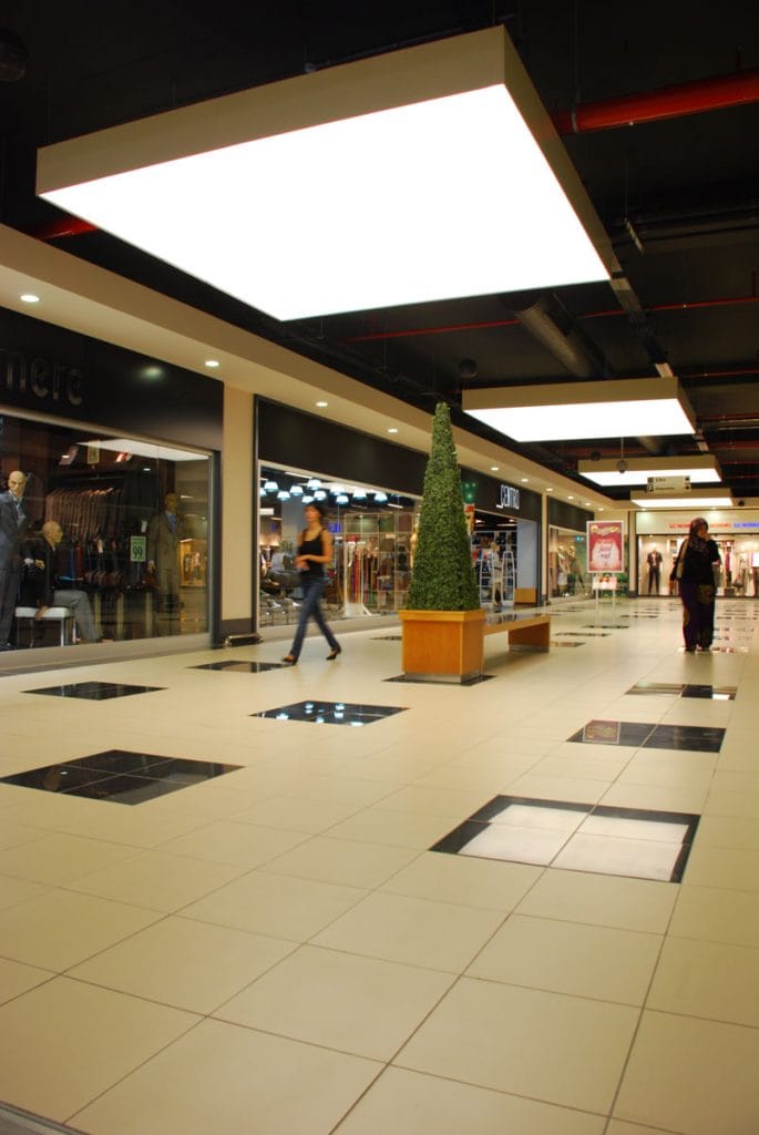 custom shopping hallway with back lit modular structures