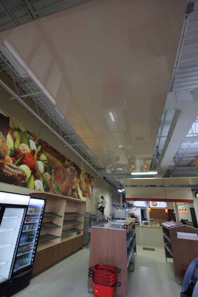 custom wall banner and beige gloss stretch ceiling