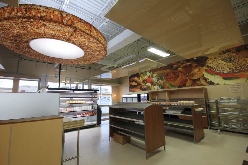Bagel Nash with Modular Structures, reflective ceiling and banner