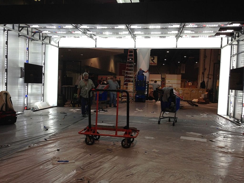 in progress of installing gloss stretch ceiling with back lit