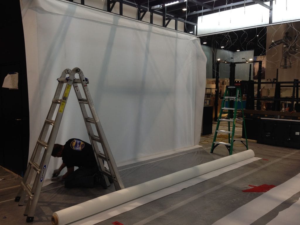 preparing custom wall cover for exhibition